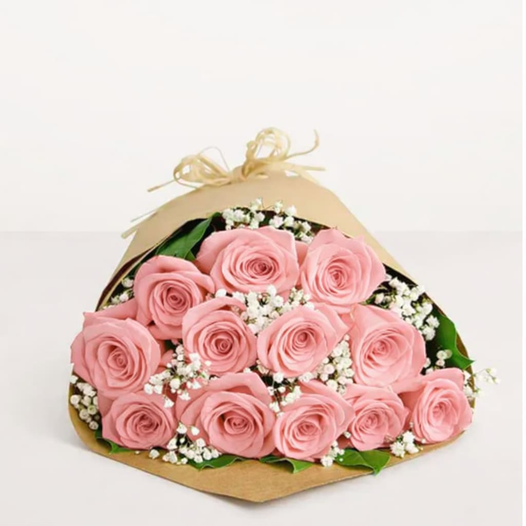 Premium Long Stem Pink Rose Bouquet - A dozen vibrant and fresh long stemmed Ecuadorian Roses, accented with baby's breath and assorted greenery.