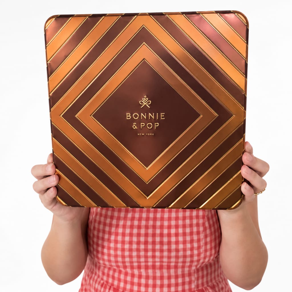 Person holding a large Bonnie &amp; Pop gift tin