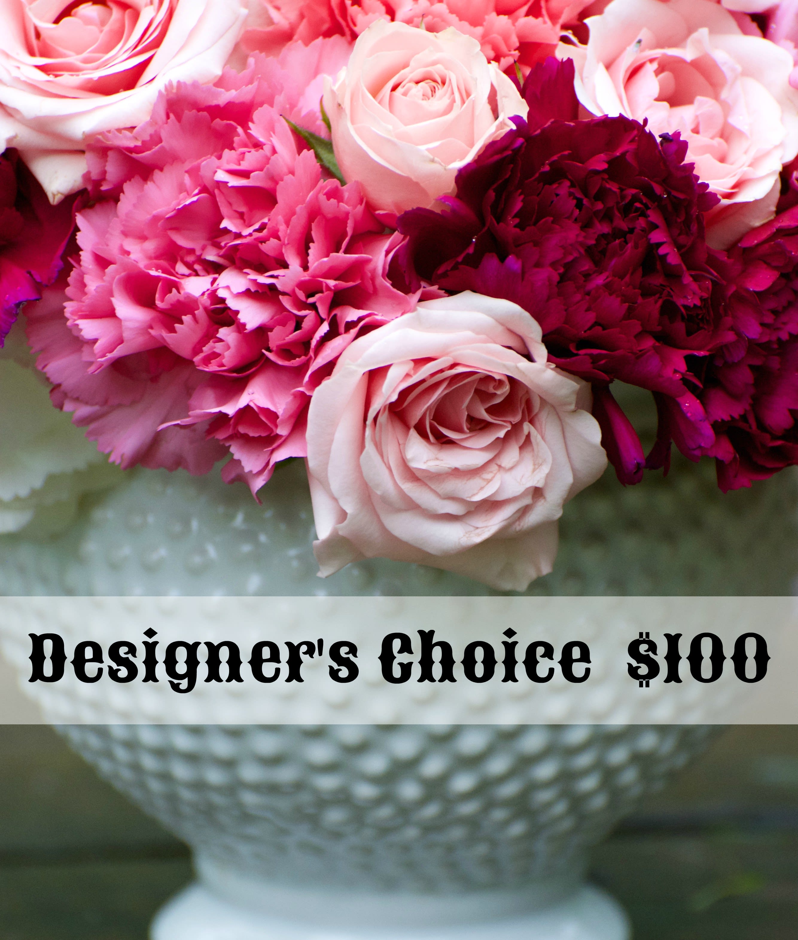 Pink and burgundy roses with carnations in a white vase