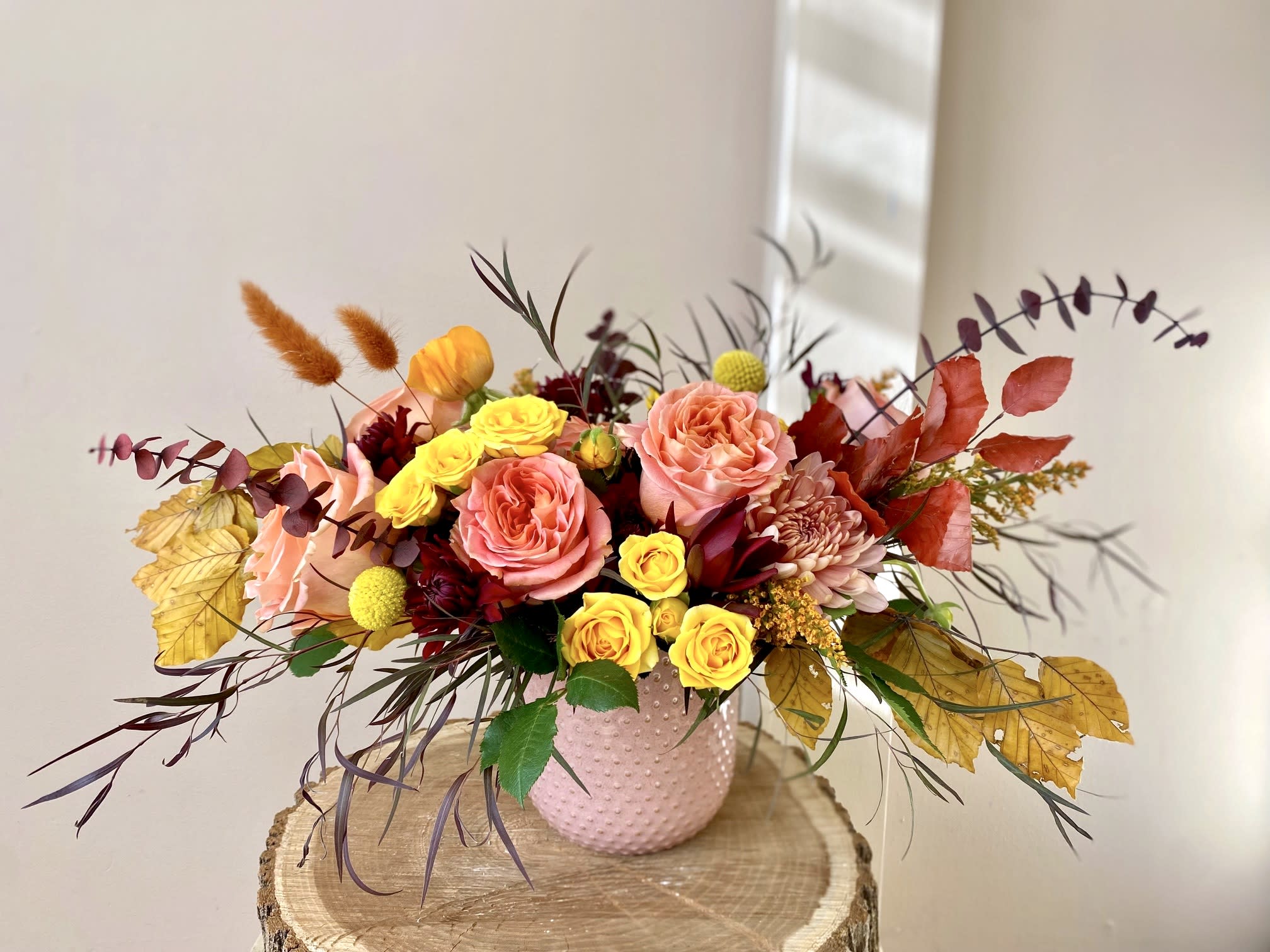 Dance in the breeze with the crisp golden leaves - This cute and colorful arrangement will hug your loved one's heart and Soul, will bring some light and joy to their days. Filled with bright seasonal colors it's a perfect arrangement to celebrate one's Birthday, send best wishes or show how grateful you are to have them in your life.  Flowers will come arranged in a ceramic vase (vase color may vary based on availability).