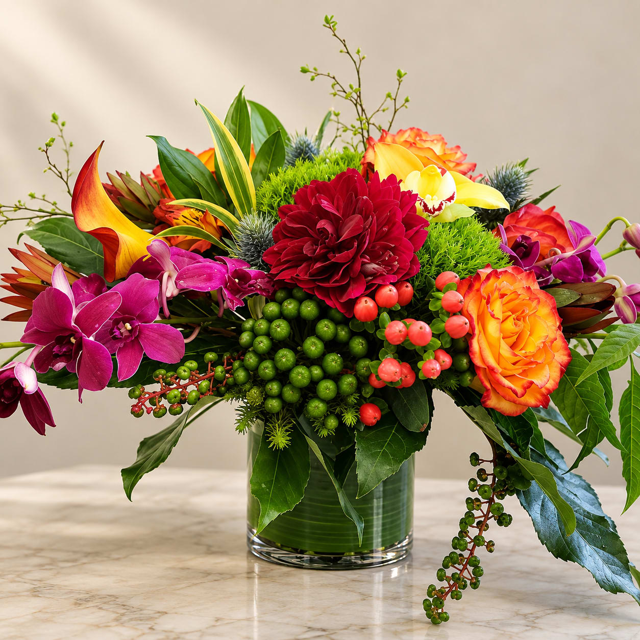 Colorful mixed flower arrangement in a clear glass vase