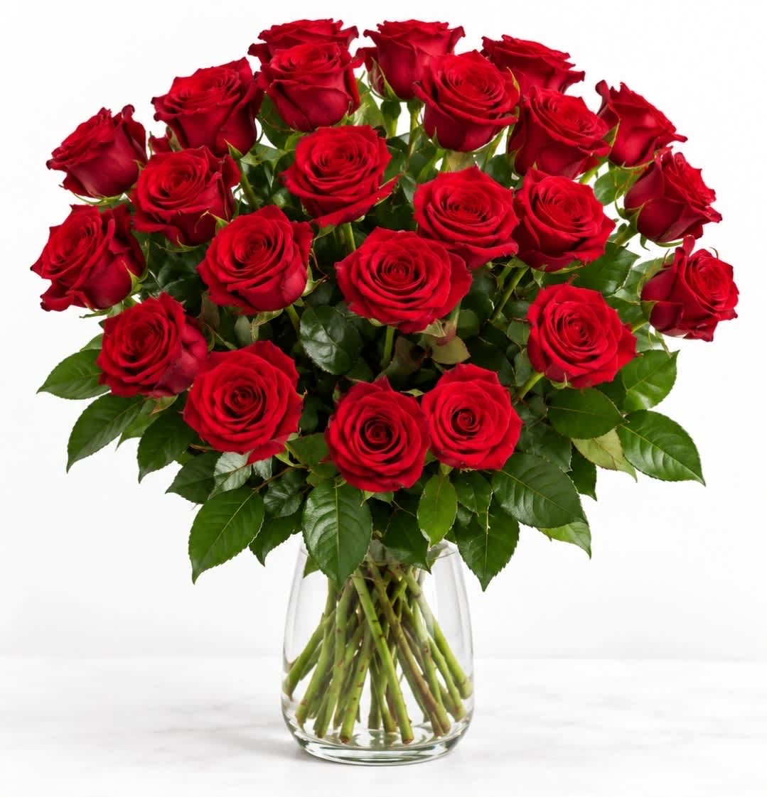 Bouquet of red roses in a clear glass vase