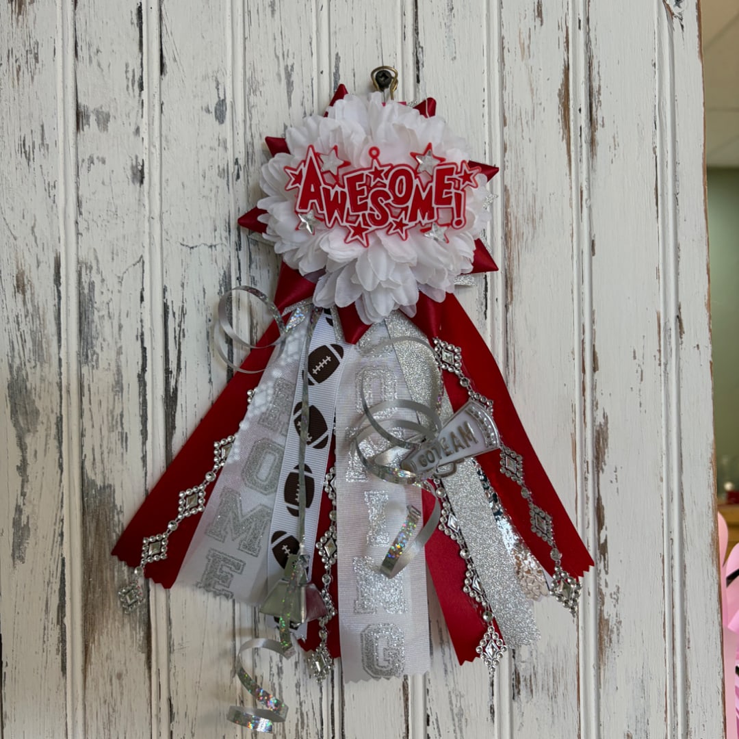 Red and white ribbon award rosette with "AWESOME!" and football-themed streamers