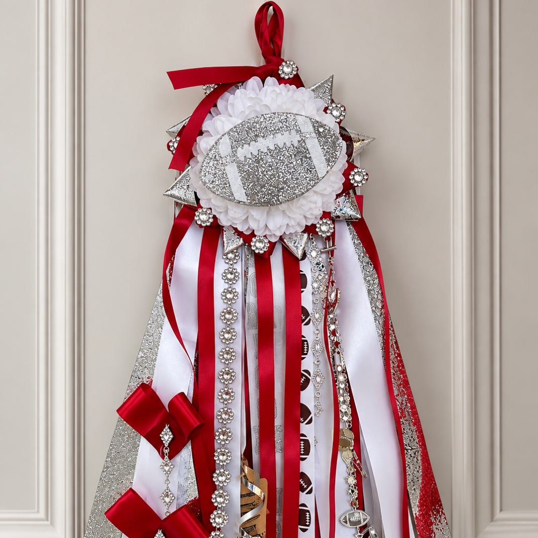 Red and white ribbon football-themed hanging decoration with silver accents