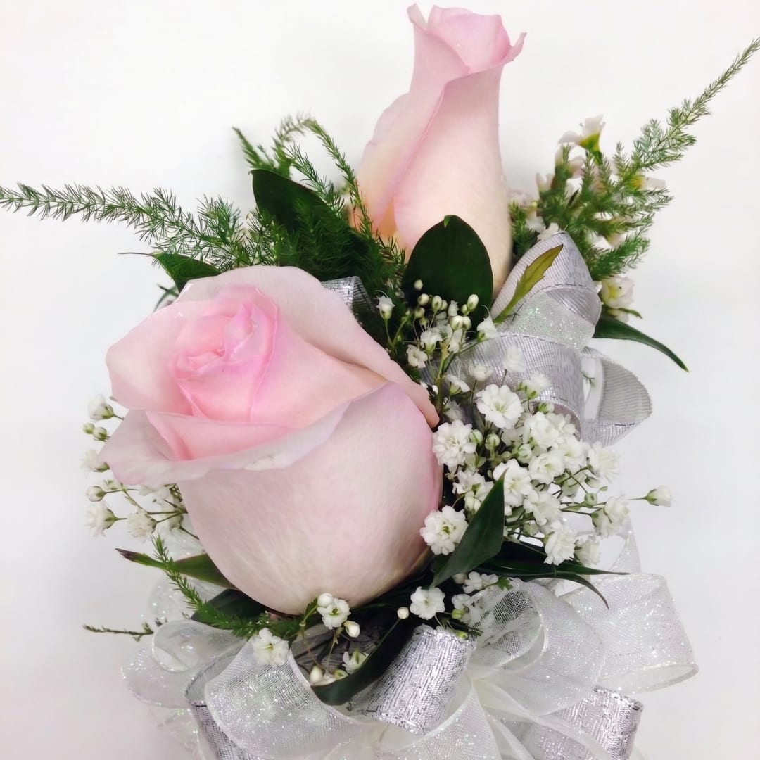 Pink rose bouquet with white filler flowers and silver ribbon