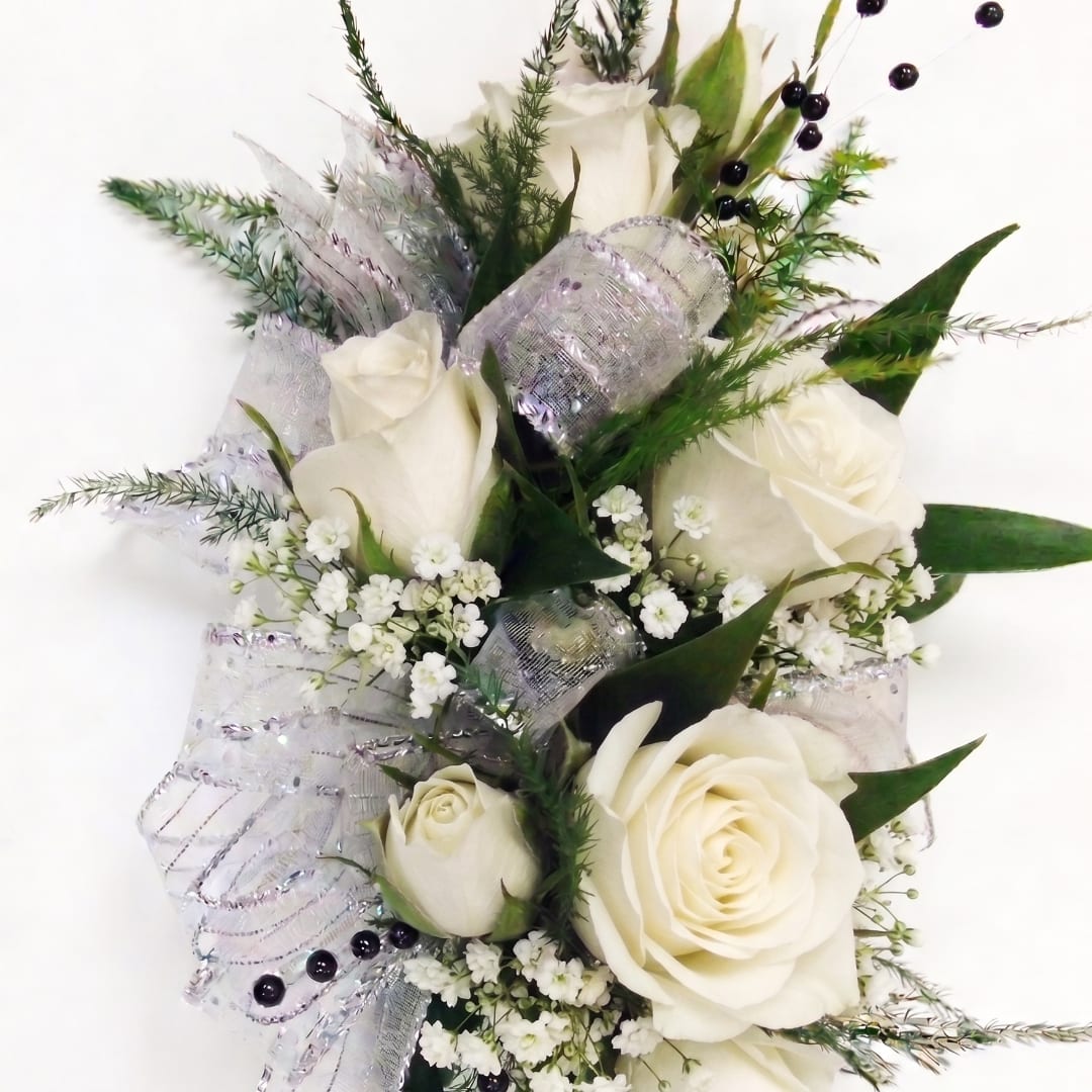 White rose bouquet with silver ribbon and small white filler flowers