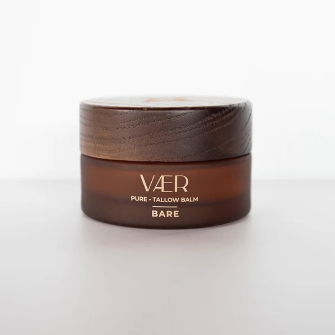Brown balm jar with a wooden lid on a white background