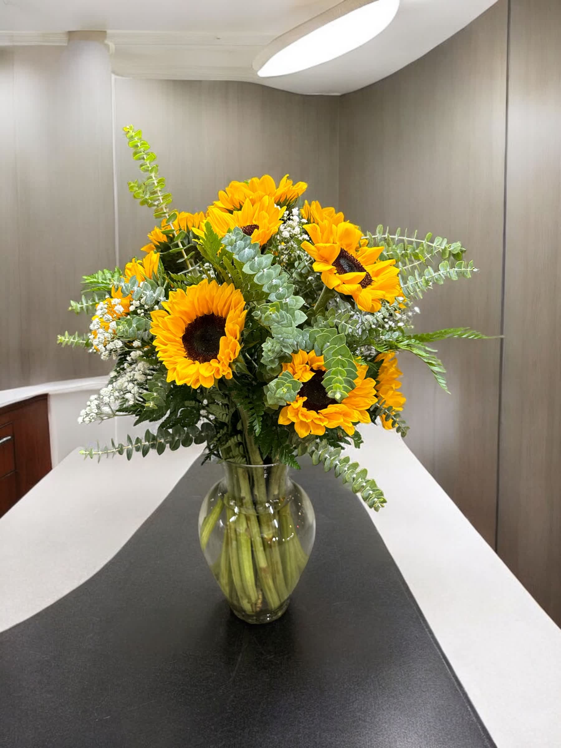 Sunflower bouquet in a clear glass vase