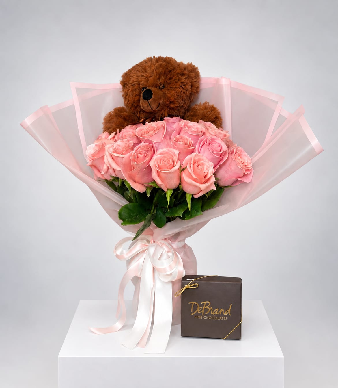 Pink rose bouquet with a teddy bear and chocolate box