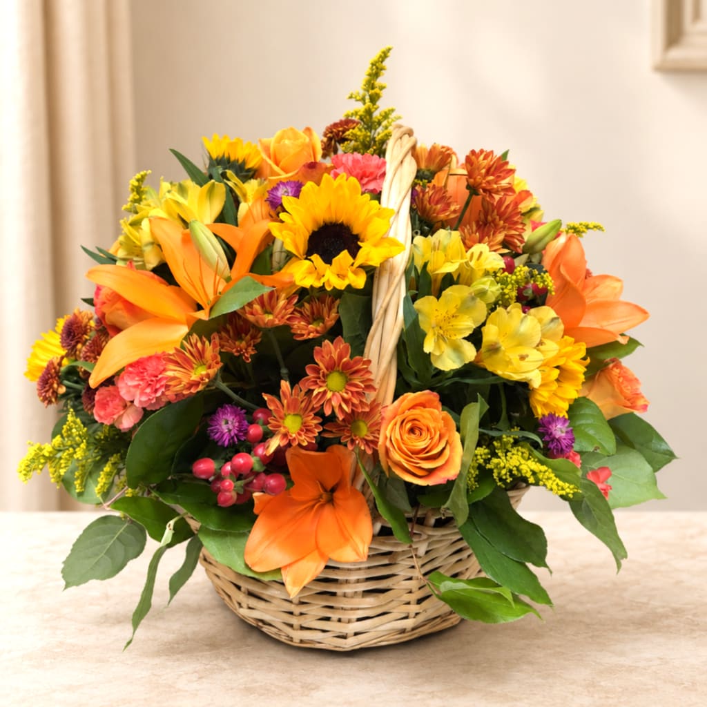 Basket arrangement with sunflowers, lilies, roses, and mixed blooms