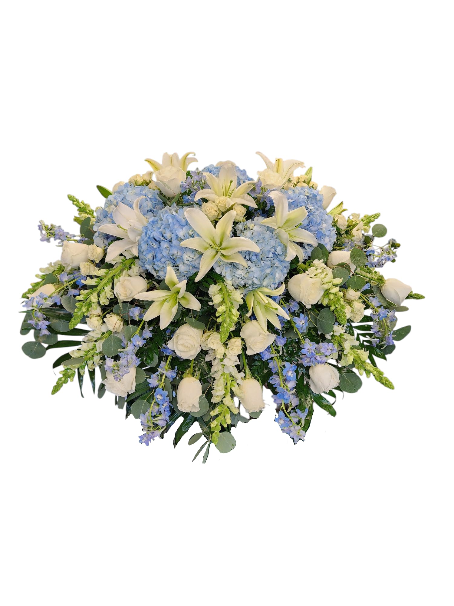 Blue hydrangea and white lily bouquet with roses and greenery