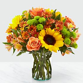 Eckert Florist's FTD Autumn Splendor™ Bouquet - Say hello to autumn with this bouquet filled with bold harvest hues and luscious blooms. Thoughtfully arranged with the freshness of fall in mind, a collection of autumn-colored flowers is set beautifully in a clear glass vase. Whether it's seasonal décor for your home or a gift for a loved one, our Autumn Splendor Bouquet is sure to make any home its placed in feel warm and bright. *Flowers and colors may vary