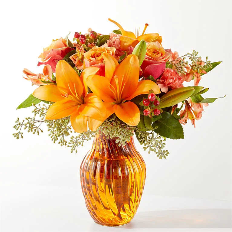 Eckert Florist's FTD Afternoon Light Bouquet - Radiating light and warmth like the afternoon sun through a bay window, this fusion of varying shades of orange will bring a moment of peace to their day. *Flower variety and color may vary.