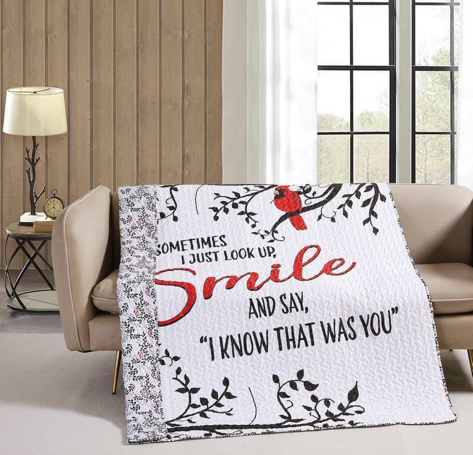 Quilted throw blanket with a cardinal and the words "Smile" and "I know that was you"