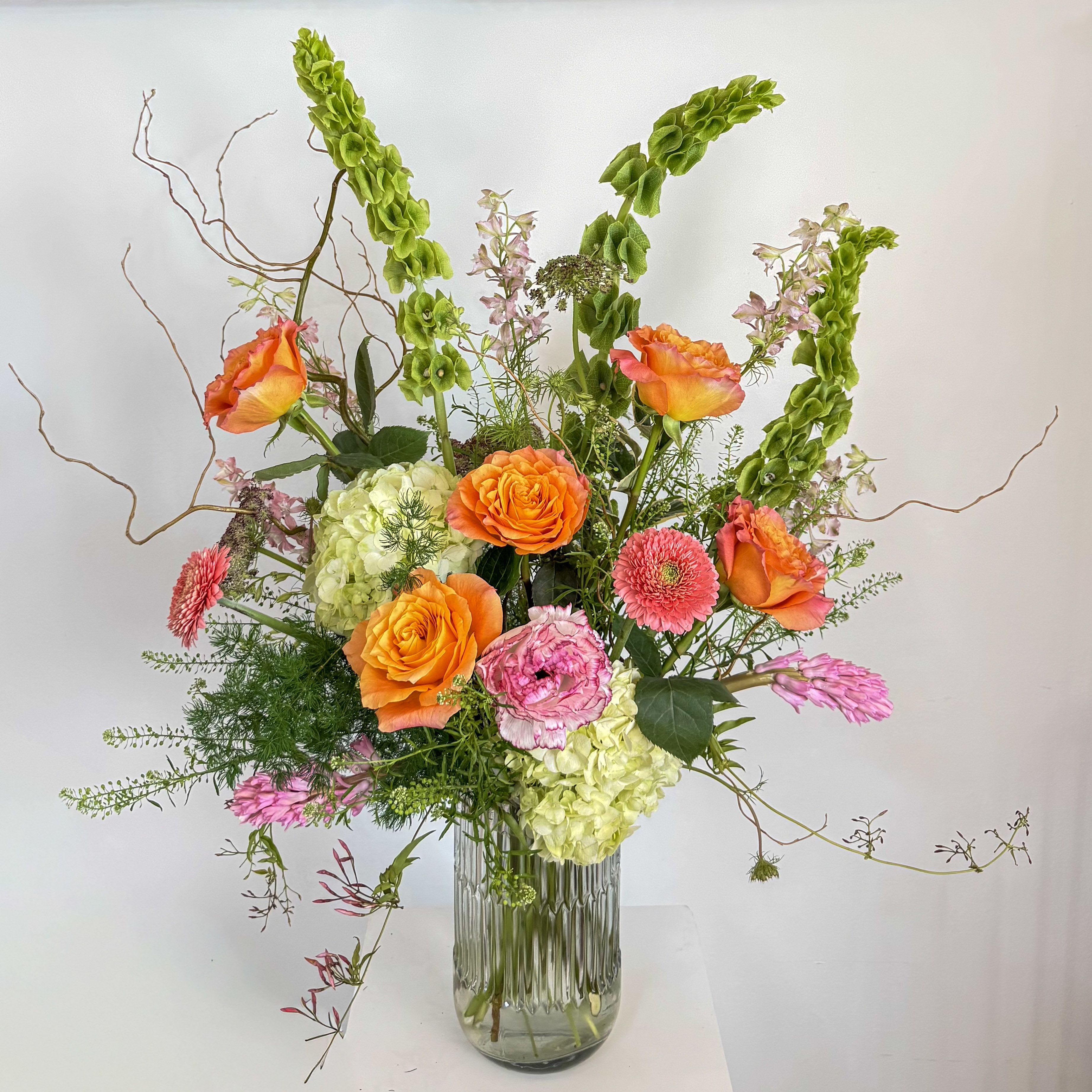 Designer's Choice: Garden Luxe - A bright palette of our freshest flowers in a large dramatic presentation. Sure to get a "wow."  Standard size measures approximately 19" x 32". 