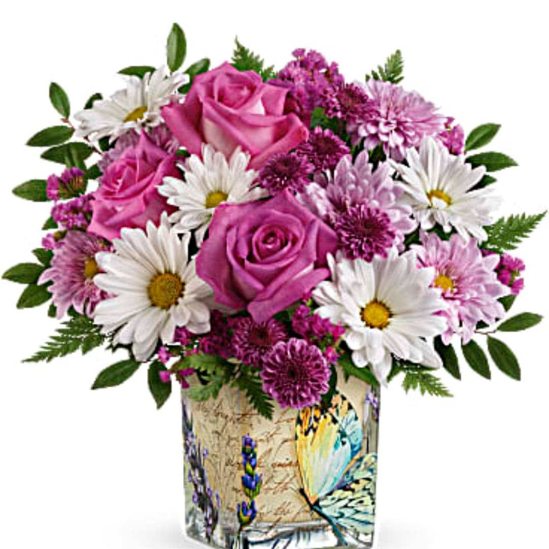 Pink roses and white daisies in a decorative vase