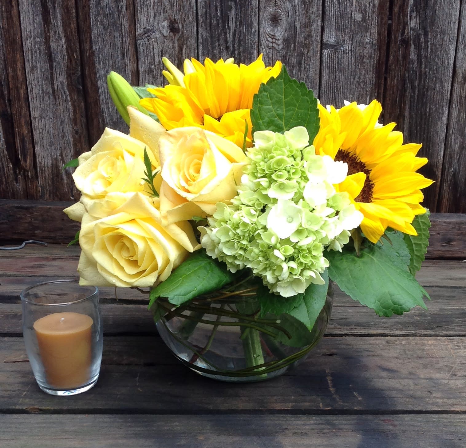 Rays of Sunshine  - A burst of Sunflowers with yellow Roses and Hydrangea in a bubble bowl.