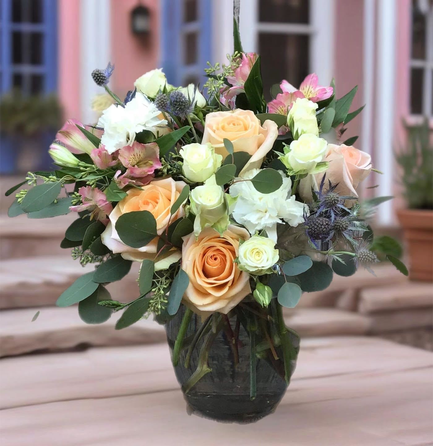 Dream Come True - This is what dreams are made of! Enjoy a variety of natural greenery encasing pink roses and a mix of white flowers. 