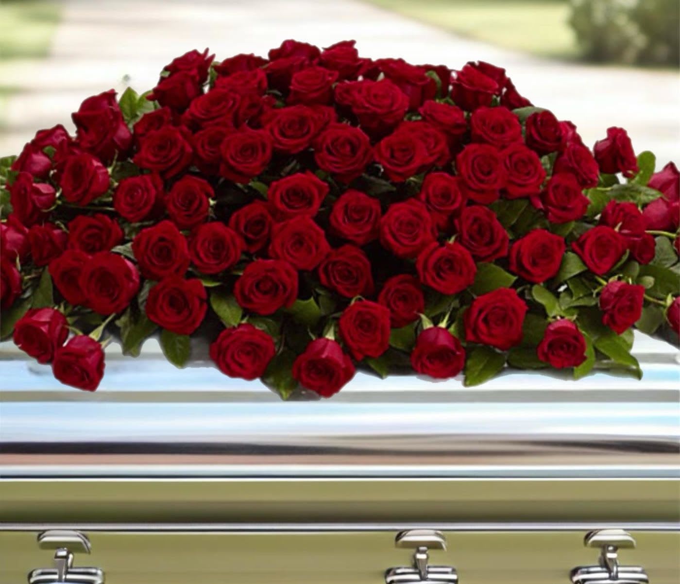 Large spray of red roses on a casket