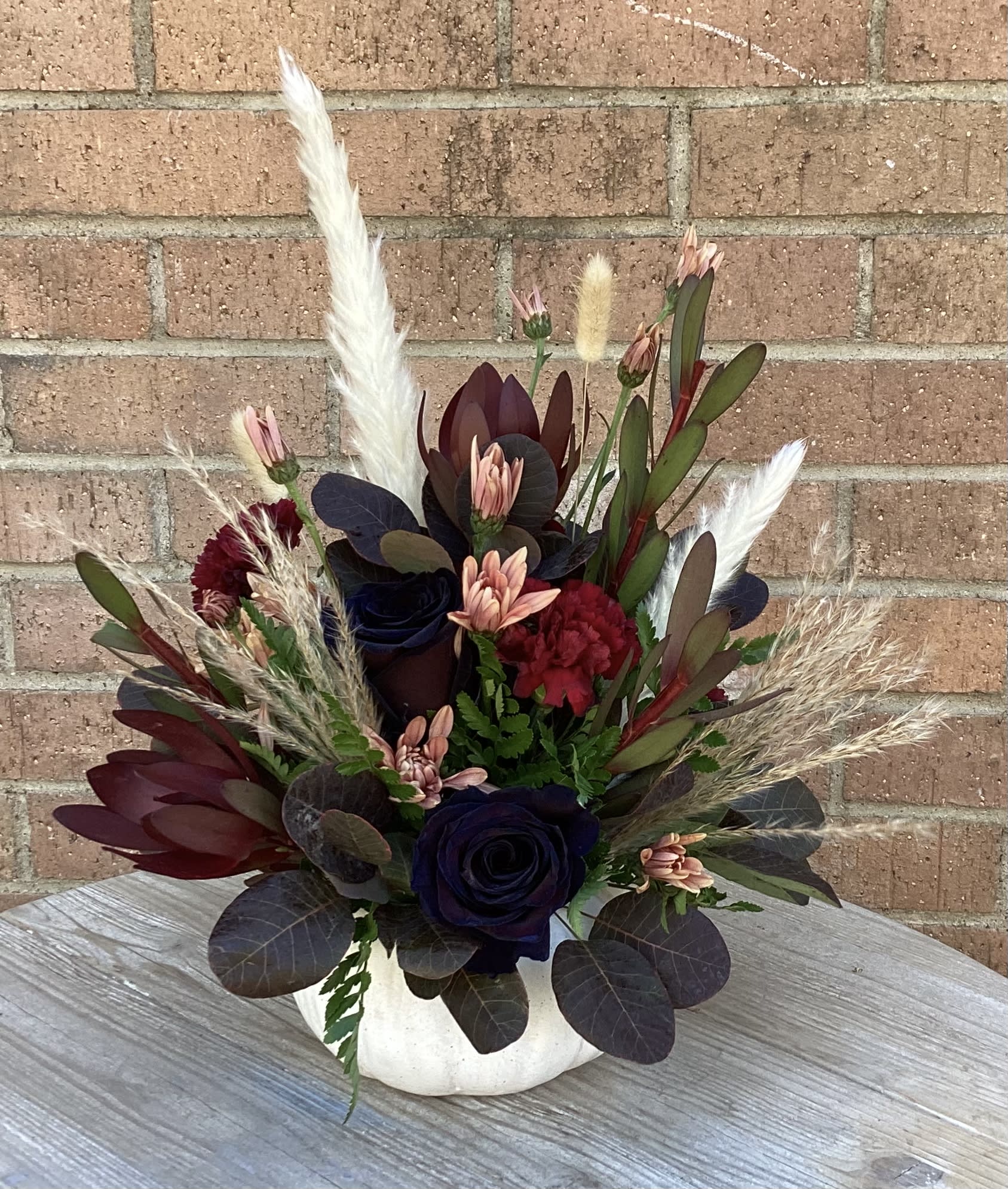 Boho Pumpkin  - White Ceramic Pumpkin with a mix of fall colored flowers, pampas grass and other fun boho dried florals. (Pumpkin container size for reference 4''x7'' not including florals)