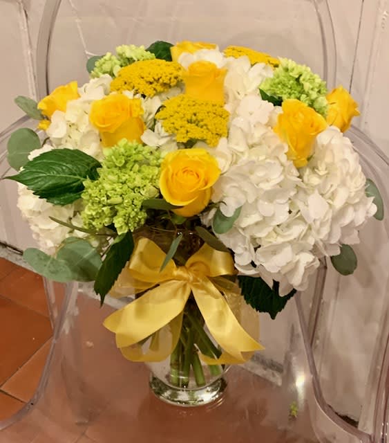 You Are My Sunshine - Bright and cheerful, you can't go wrong with this mix of hydrangeas and roses! The vase is cool too ;)
