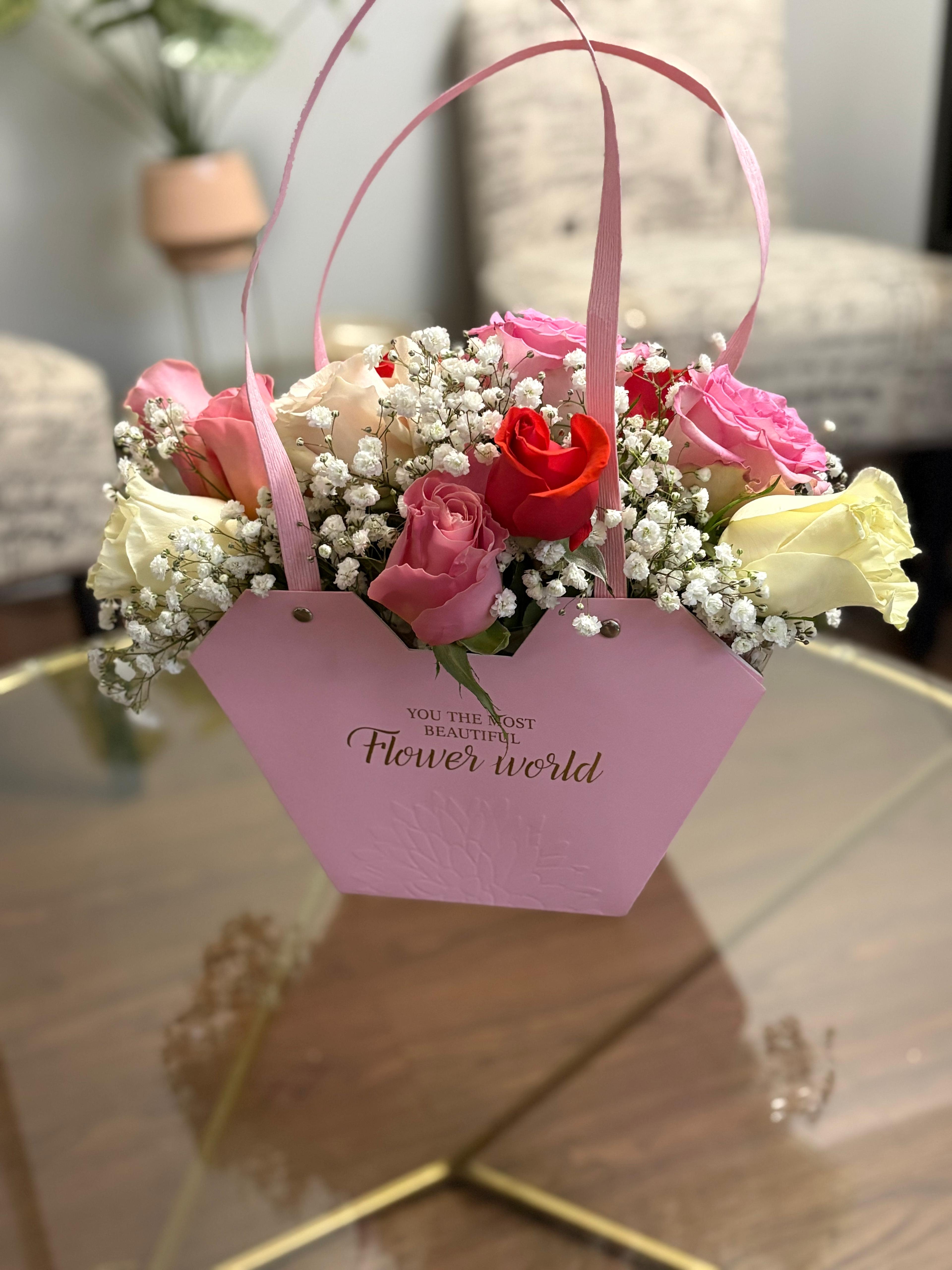 Pink gift bag with roses and baby's breath