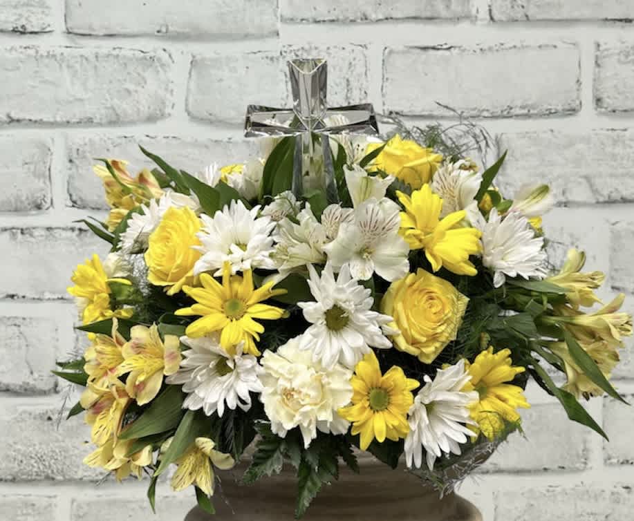 Divine Blessing  AF115 - Divine Blessing  Beautiful led crystal cross surrounded by a mixture of yellow and white seasonal flowers combine to make a beautiful tribute.