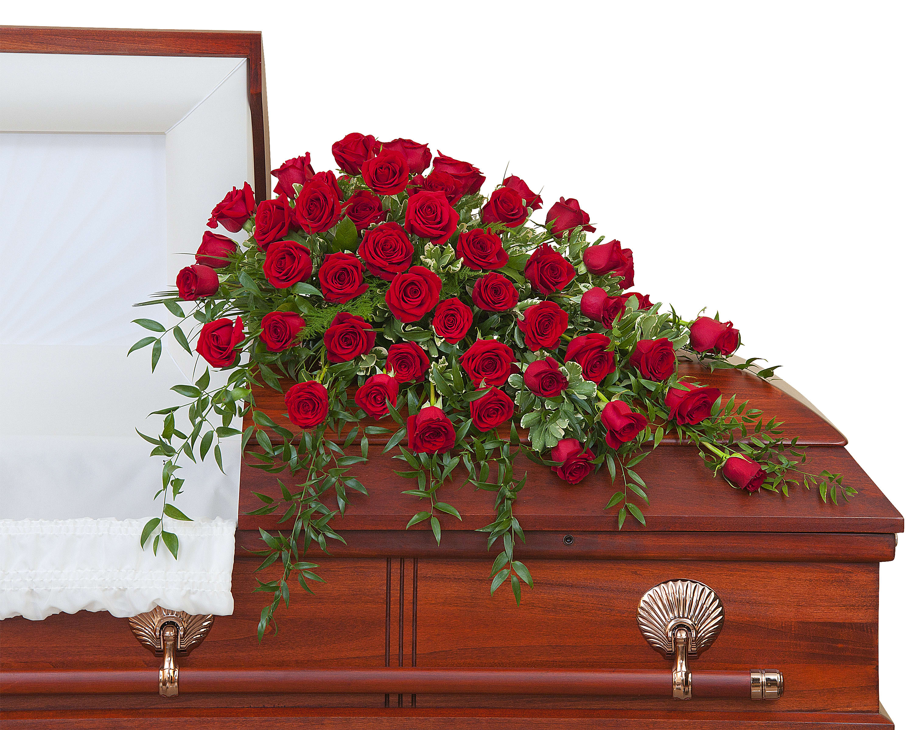 Red rose spray on a wooden casket