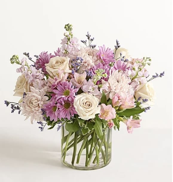 Bouquet of pink and white flowers in a clear glass vase