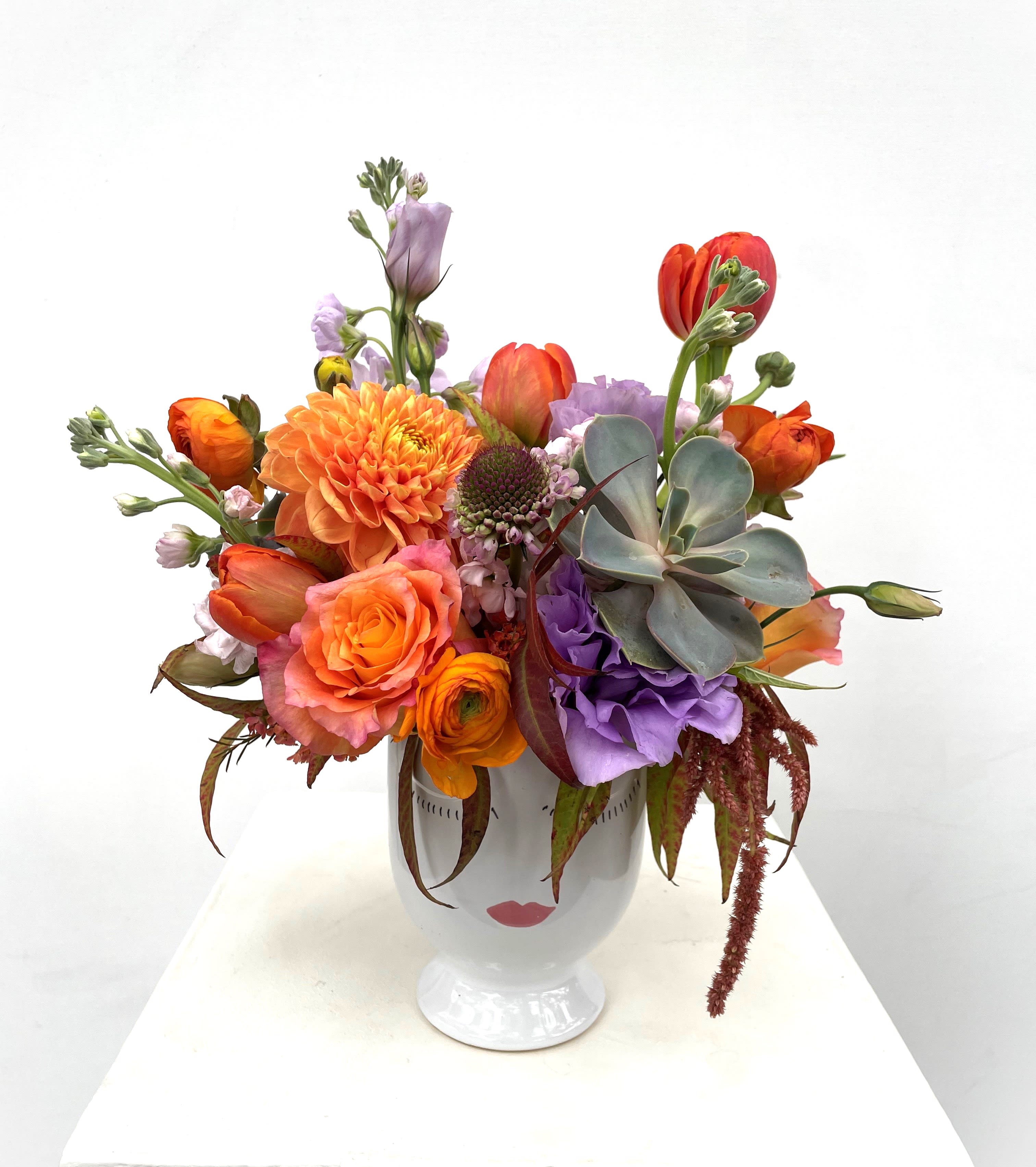 Freya - Fall hair don't care! This lavender and orange colored arrangement is as cool as a fall breeze!
