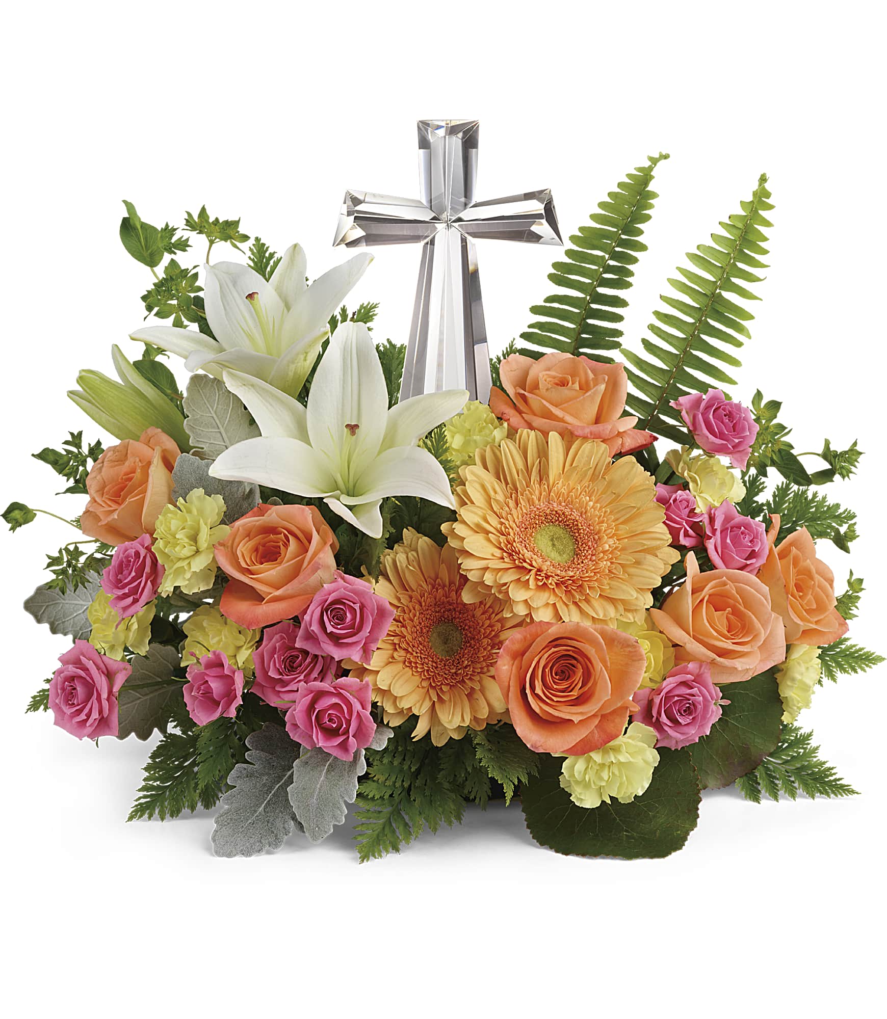 Floral arrangement with white lilies, roses, gerbera daisies, and a silver cross