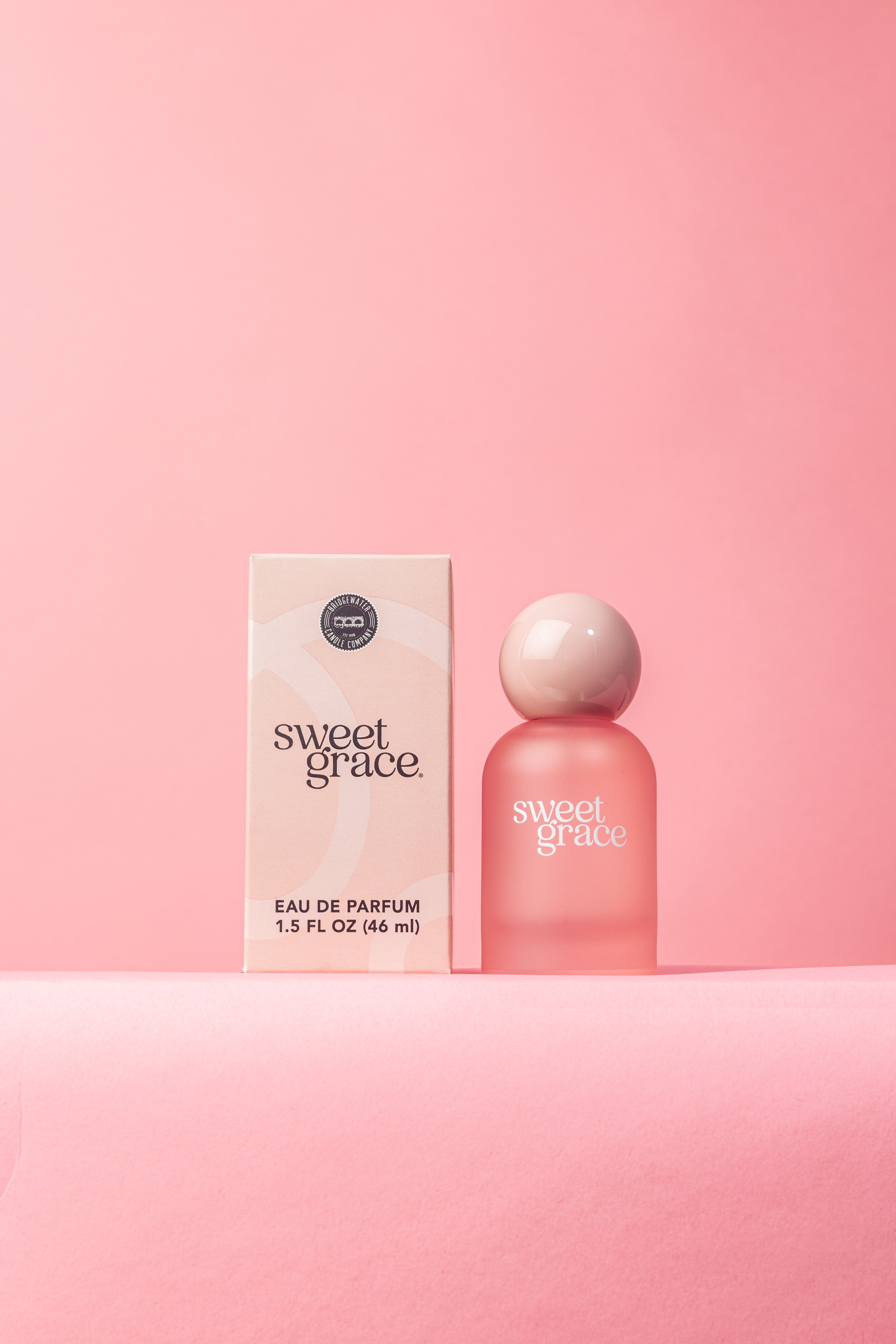 Sweet Grace Eau de Parfum (1.5 oz) - Wrapped in a dreamy frosted pink bottle with a glossy pink ball top, this perfume will quickly become the new go-to. This scent is pure happiness in a bottle, featuring the iconic Sweet Grace fragrance. Elevate your every day with a fragrance that’s as unforgettable as you are.   Fragrance Description: With exotic passion fruit, sparkling tea and classic patchouli, Sweet Grace is undeniably warm, peaceful and pure.