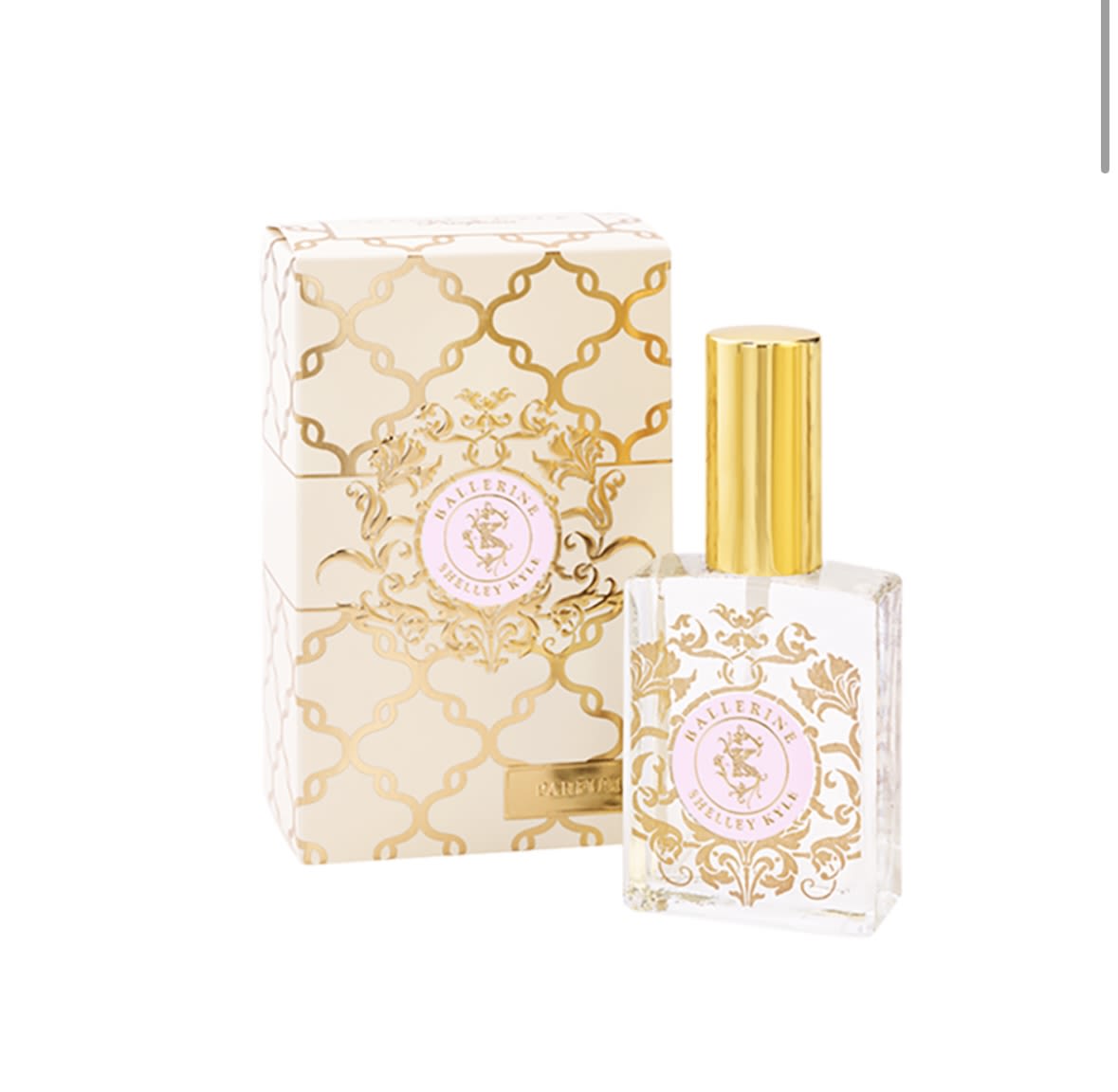 Perfume bottle with gold cap beside a matching patterned box