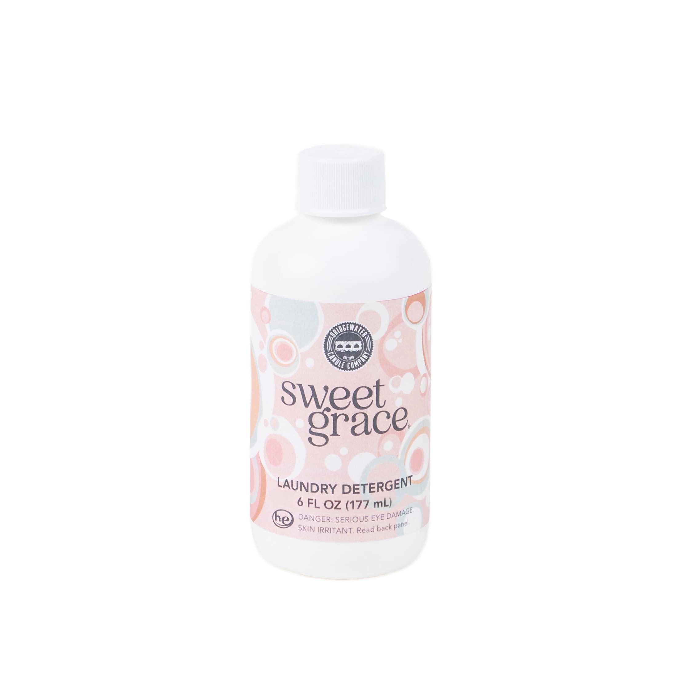 Bottle of Sweet Grace laundry detergent with a pastel patterned label