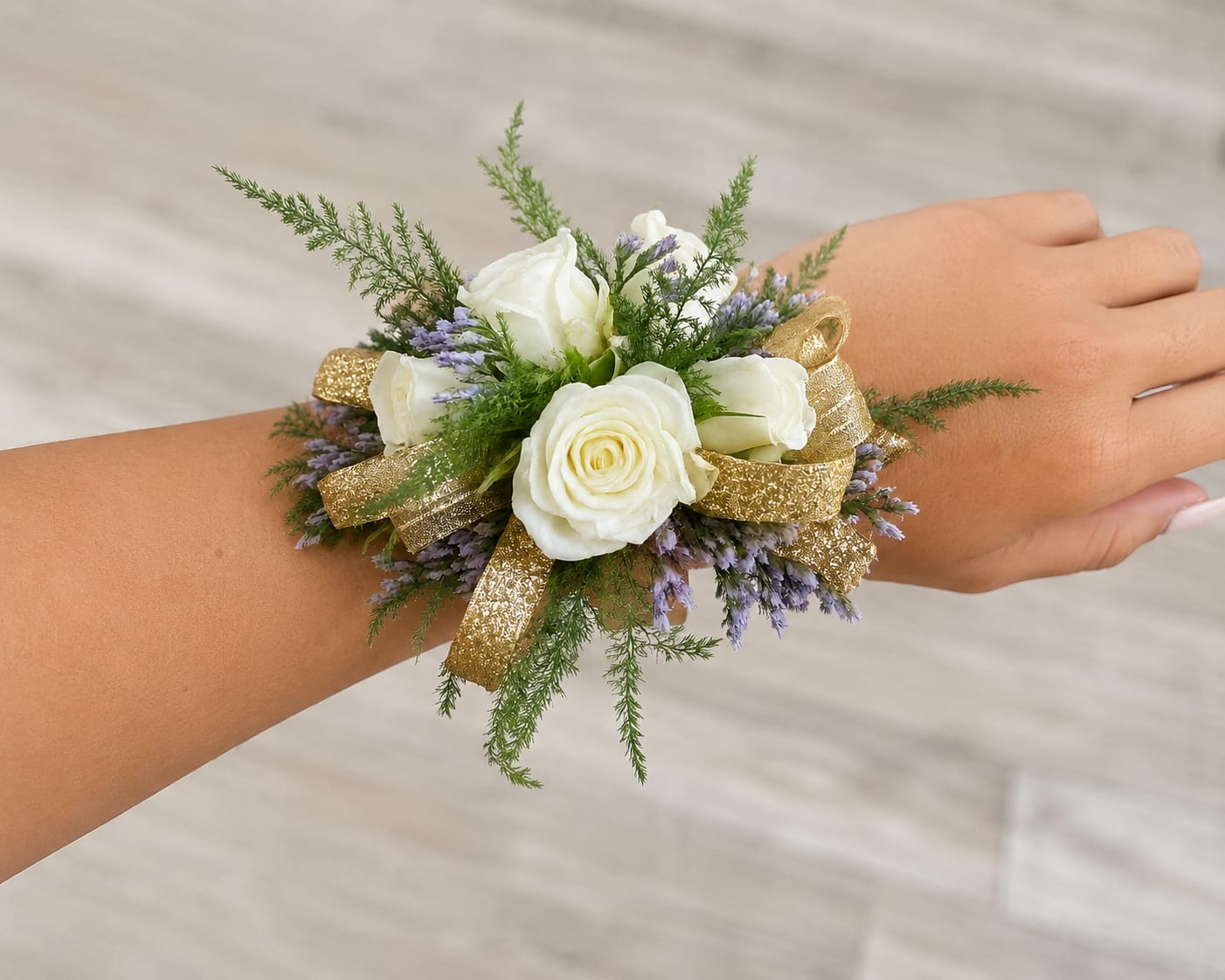 White rose wrist corsage with purple filler and gold ribbon