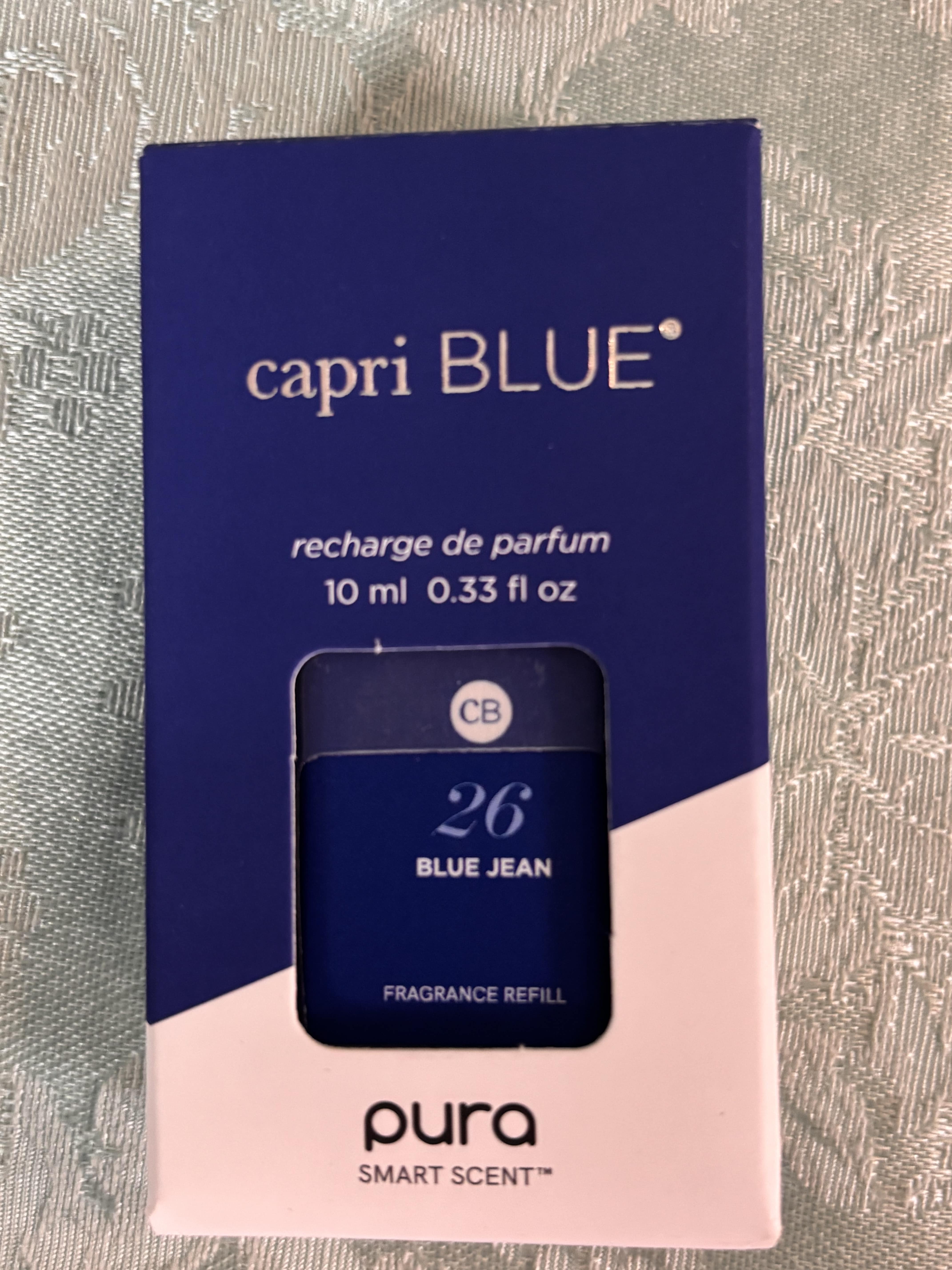 Blue perfume refill box with a small bottle visible through the front window