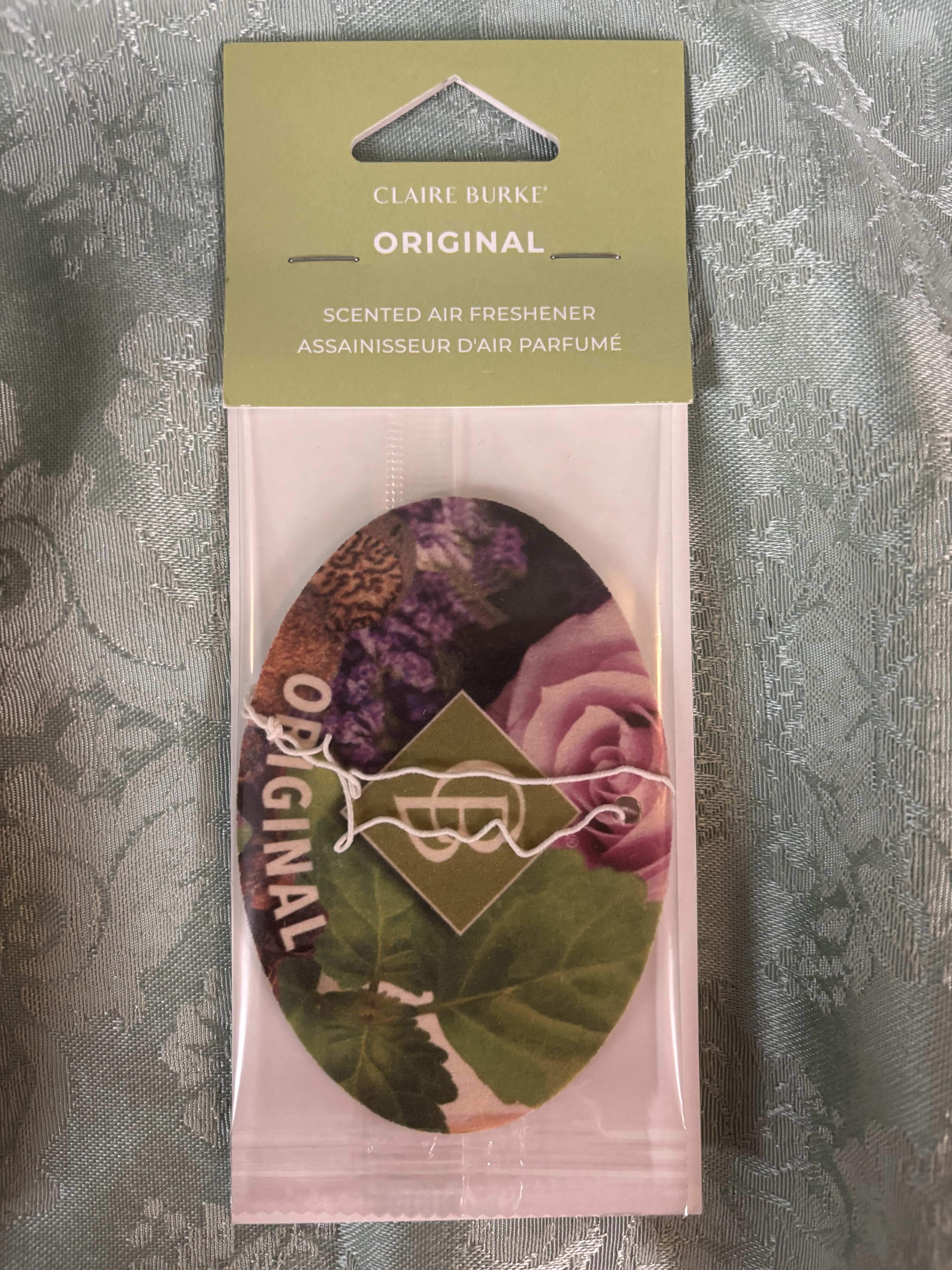 Packaged scented air freshener with a floral print
