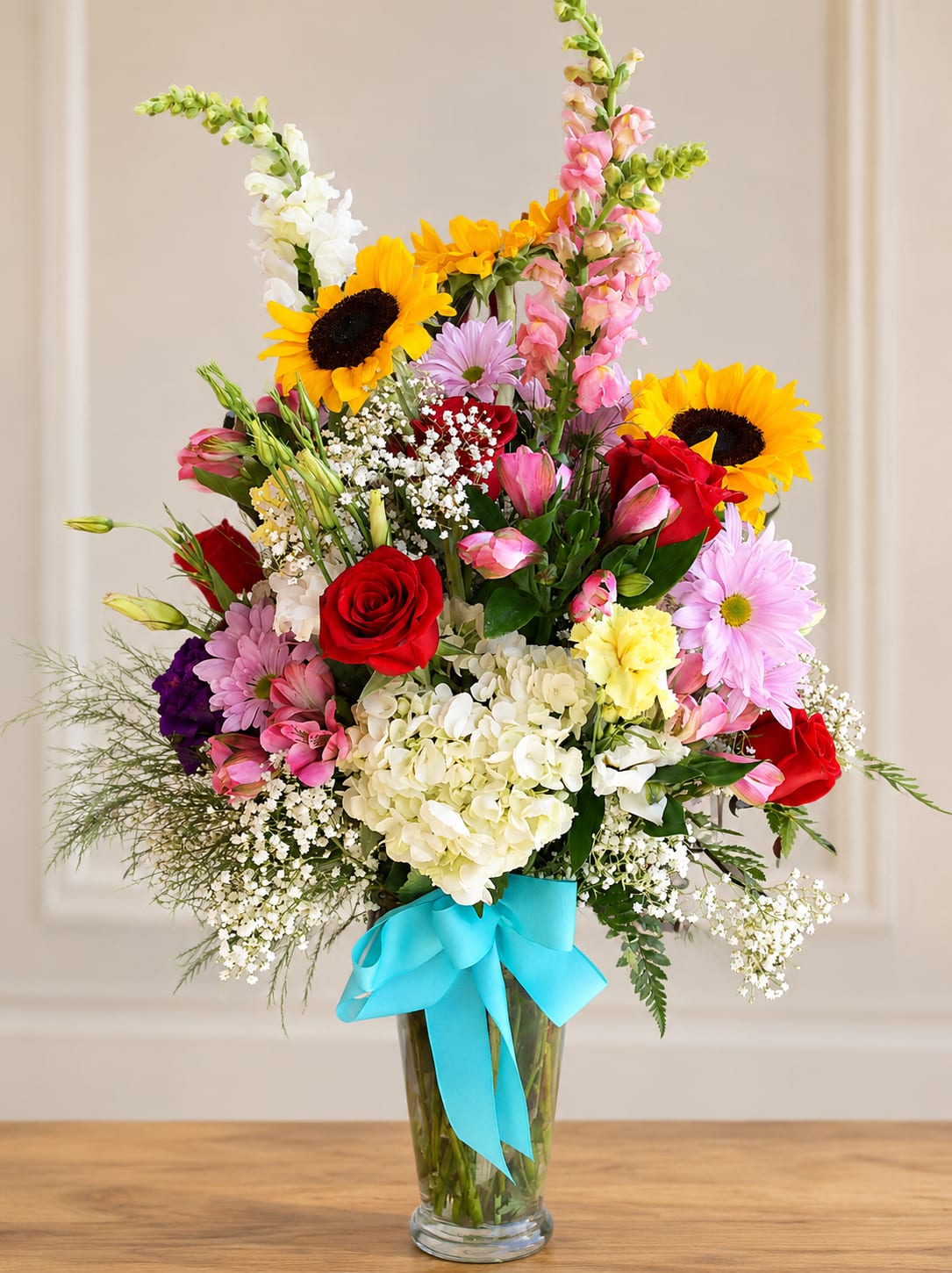 Color My World - A Bright bold display of affectionate blooms. The Perfect floral gift for the special person who colors your world. This design is mostly front faced. (All designs are arranged as similar as possible. We promise to keep the same color, style, and overall theme with what Mother Nature generously blesses us with)