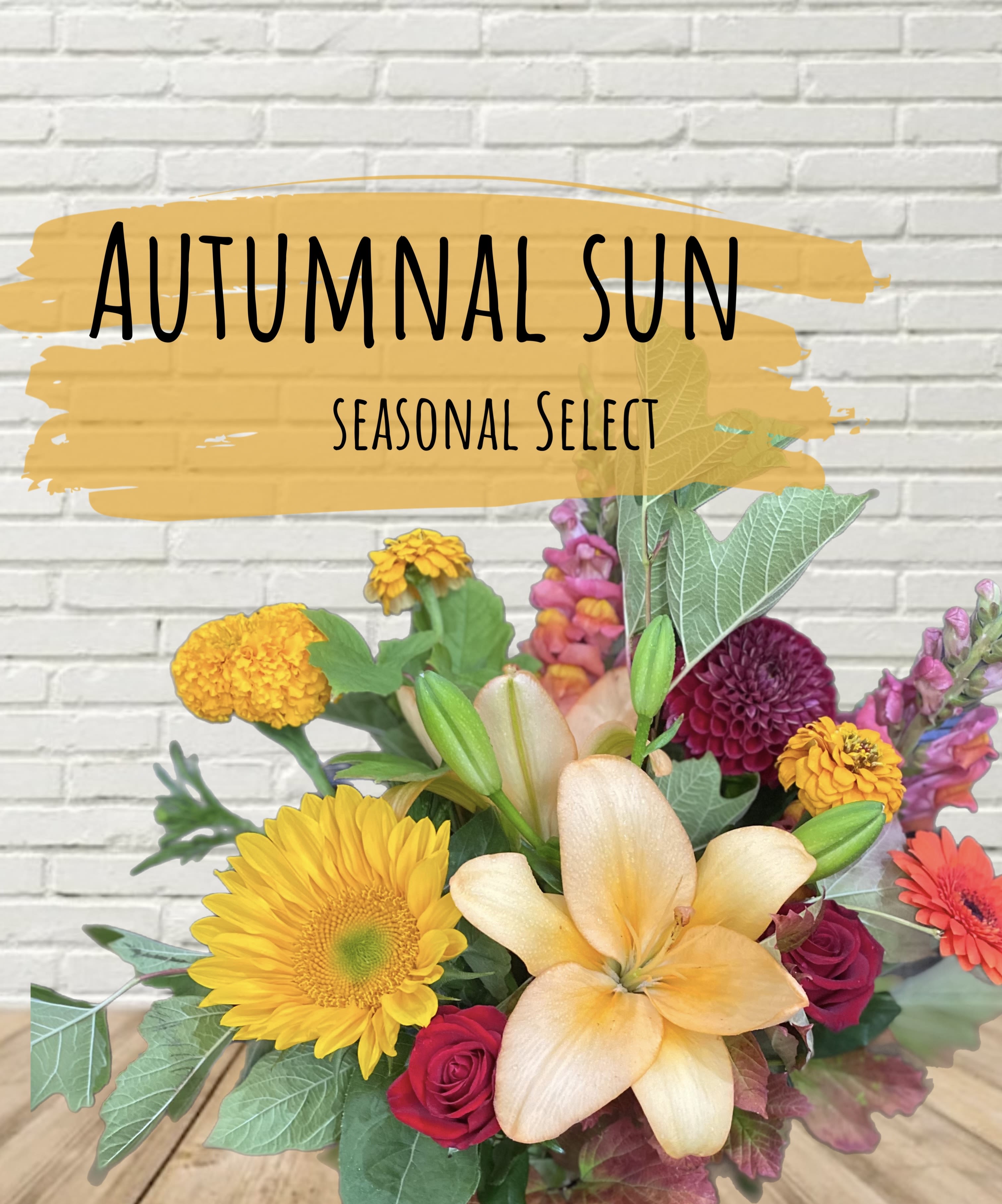 Autumnal Sun Designer Select - A seasonal autumnal delight of locally sourced flowers in a vase. Photo is inspiration for warm autumn flowers and each arrangement is made especially for your order, so it will not look exactly like the photo.