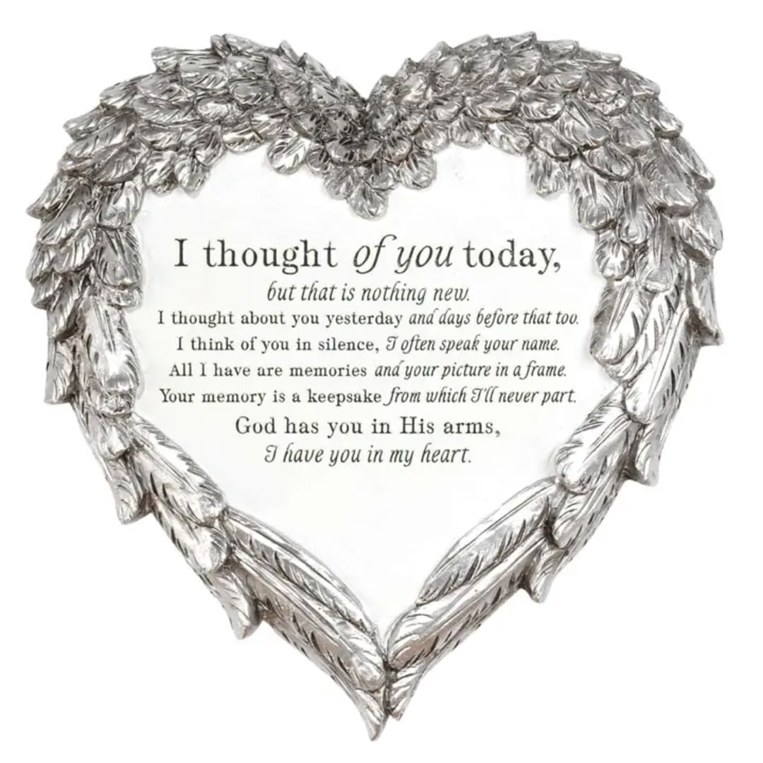 Heart-shaped silver memorial plaque with a condolence message