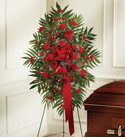 Deepest Sympathies Standing Spray - Red - Product ID: 91295   This Sympathy Standing Spray, in beautiful red, is a touching symbol of your sympathy and support. Red flowers such as roses, Gerbera daisies, spray roses, carnations and more An appropriate gift for family, friends and business associates to send directly to the funeral home Our florists use only the freshest flowers available, so colors and varieties may vary Large measures approximately 46"H x 42"L without easel Medium measures approximately 46"H x 38"L without easel Small measures approximately 42"H x 30"L without easel