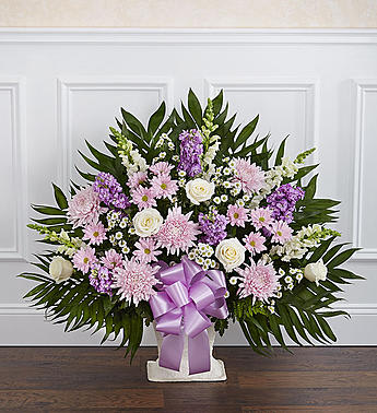 Tribute Lavender &amp; White Floor Basket Arrangement - Product ID: 91210   Expressing all the love you feel in your heart during times of loss is not always easy. This delicate floor basket arrangement helps you convey your care and concern with beautiful lavender flowers to represent a vibrant life, and fresh, white blooms to symbolize purity and peace. Floor basket arrangement of fresh white roses, snapdragons, carnations, lavender mums, lavender stock and more Appropriate for family, friends or business associates to send directly to the funeral home Our florists use only the freshest flowers available, so colors and varieties may vary Large arrangement measures approximately 38"H x 40"L Medium arrangement measures approximately 32"H x 36"L Small arrangement measures approximately 28"H x 30"L