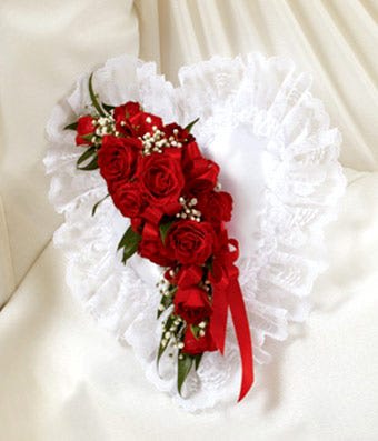 Red rose bouquet with white ruffled wrap and red ribbon