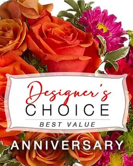Orange roses and pink daisies with an anniversary label