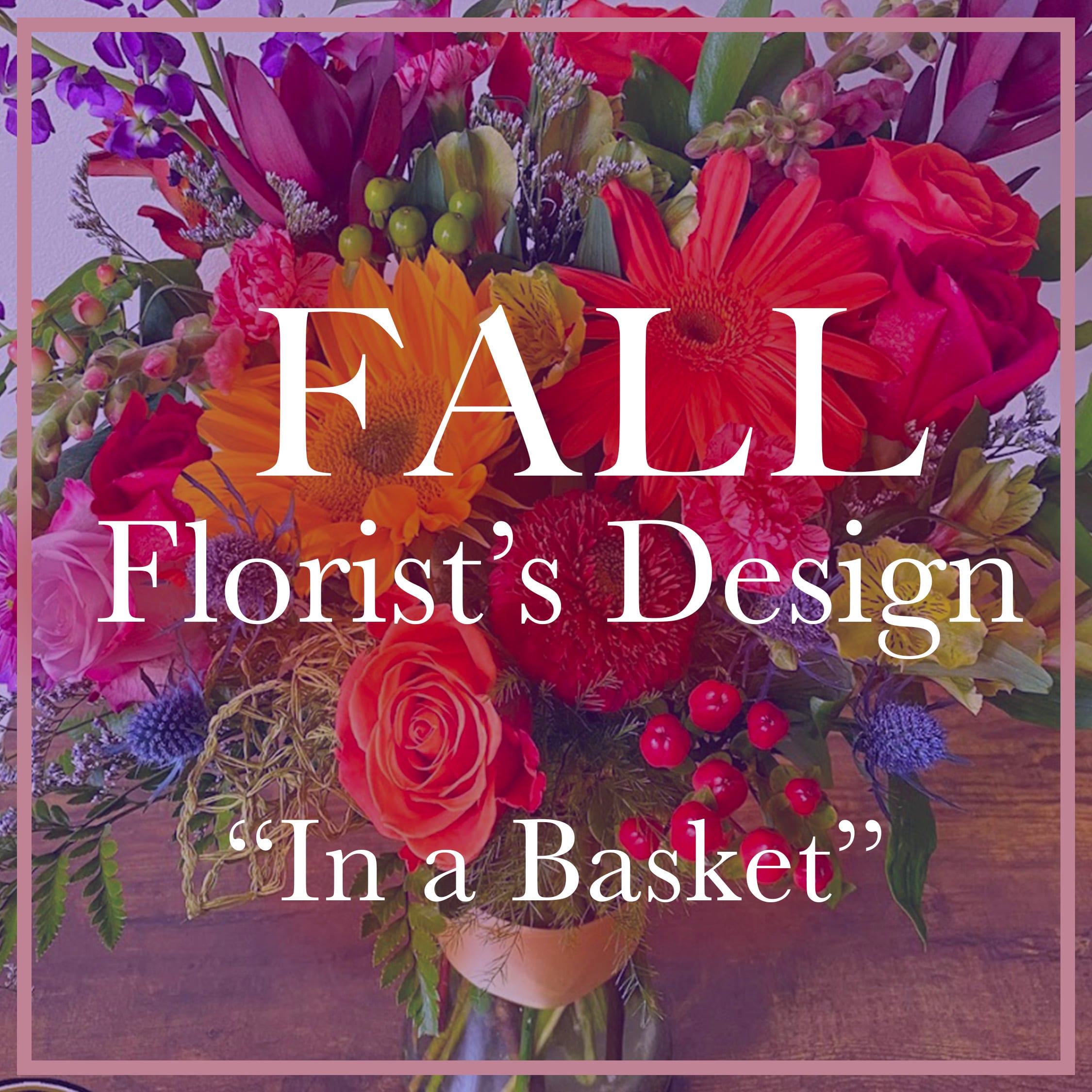 Bright fall flower arrangement with orange, red, and yellow blooms arranged in a basket.