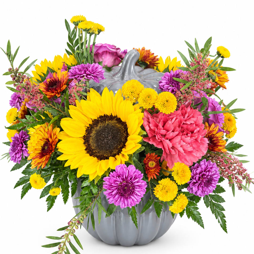 Colorful bouquet in a gray pumpkin vase with a sunflower centerpiece