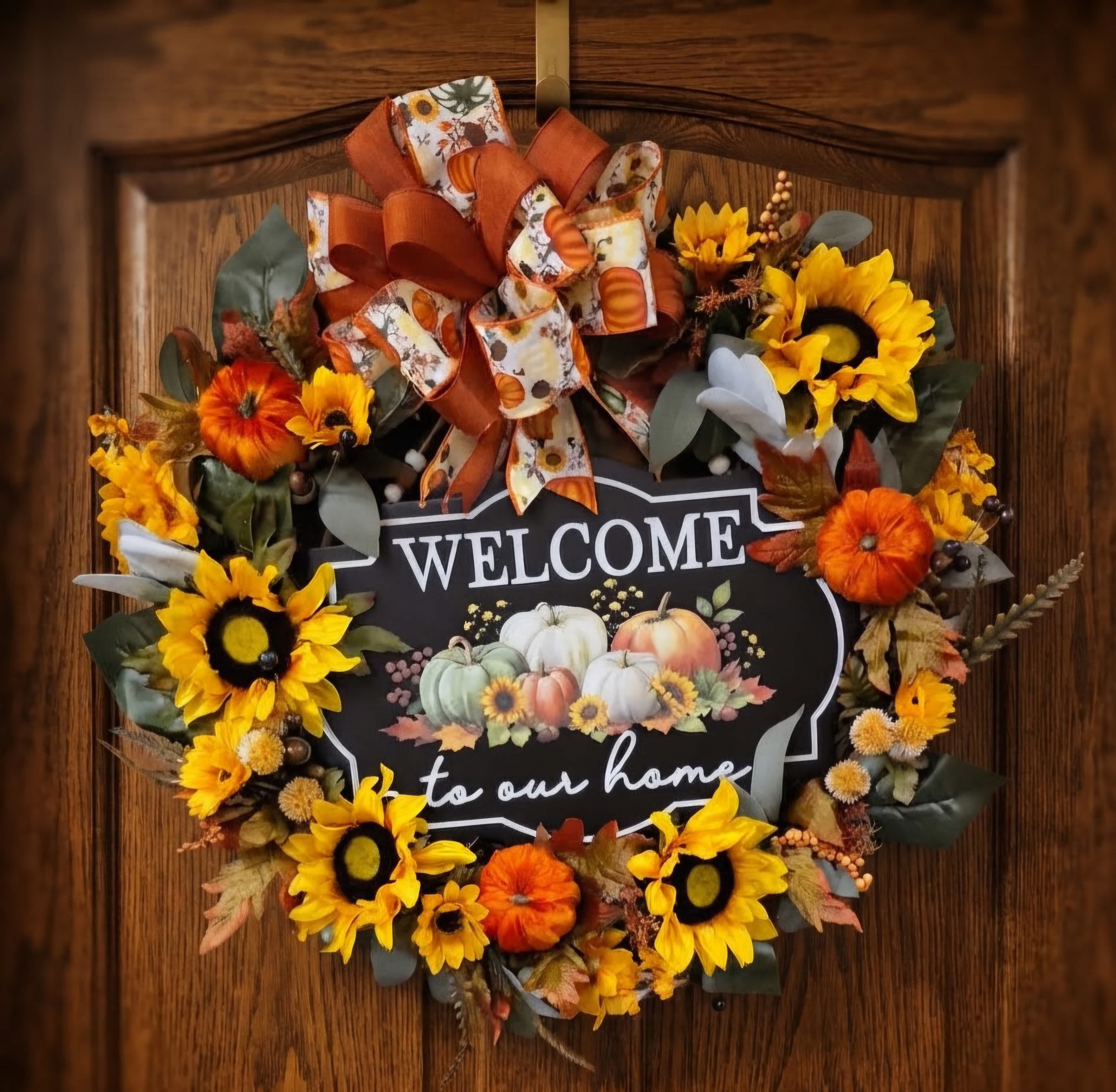 Fall wreath with sunflowers and pumpkins around a welcome sign