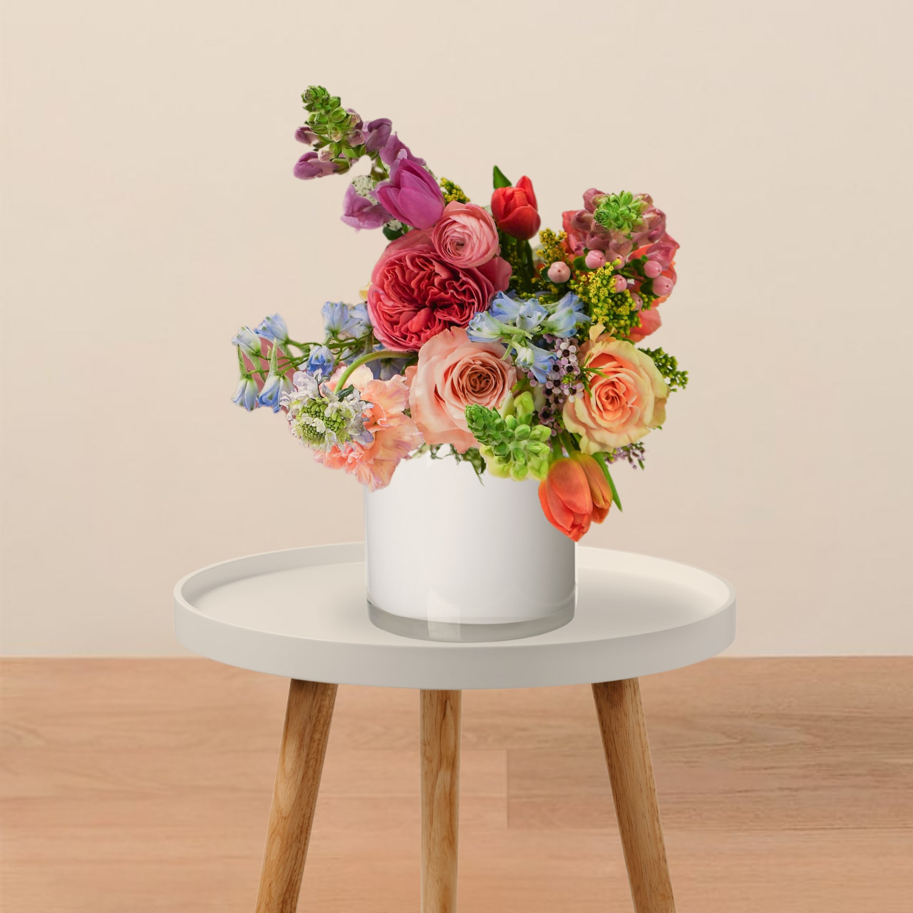 Designer’s Choice – Bright &amp; Cheerful - Colorful and full of energy, perfect for celebrations  A joyful mix of bright, uplifting colors designed to bring warmth and happiness. Our designers select the freshest blooms of the week to create a lively arrangement full of texture and movement. Arranged in a clear glass vase.  Please note: The photo shown is an inspiration for the color story, not an exact replica. Flowers, design style, and composition will vary depending on seasonal availability and the chosen size or upgrade.