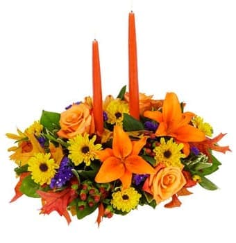 Fall Candle Centerpiece (Seasonal) - A traditional oval shaped tabletop candle centerpiece for the holiday season. Made with fresh cut daisies, roses, coffee beans and autumn leaves.