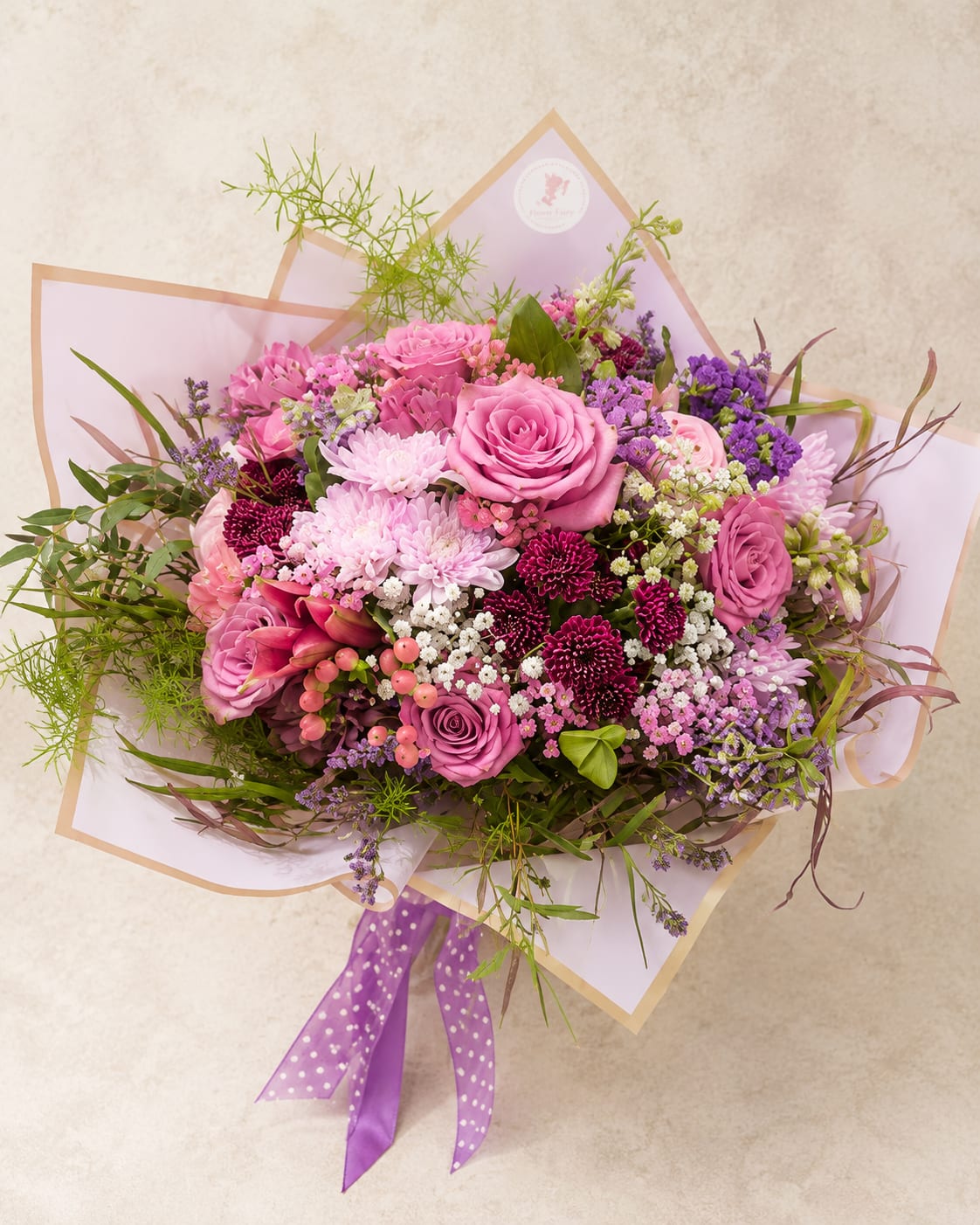 Designer's Choice Wrapped Bouquet – Seasonal Luxury Flowers - Let our floral designers create something truly unique. Our Designer's Choice Wrapped Bouquet is handcrafted using the freshest seasonal flowers available each day, allowing every bouquet to showcase the best blooms while reflecting Flower Fairy's signature garden-inspired style.  Each bouquet is thoughtfully designed with a harmonious blend of premium flowers, seasonal accents, fresh greenery, and elegant waterproof wrapping finished with a satin ribbon. No two bouquets are exactly alike, making every arrangement a personal and one-of-a-kind gift.  Perfect for birthdays, anniversaries, congratulations, thank-you gifts, Mother's Day, get well wishes, or simply brightening someone's day. If you love beautiful flowers but prefer to leave the creative details to our designers, this is the perfect choice.  Each bouquet is handcrafted by Flower Fairy using the freshest flowers available. While flower varieties and colors will vary based on seasonal availability, we always preserve the overall style, color palette, and premium quality of every design.  Features  Designer's Choice bouquet Seasonal premium flowers Garden-style design Luxury waterproof wrapping Satin ribbon finish Handcrafted by Flower Fairy Same-day flower delivery in Phoenix